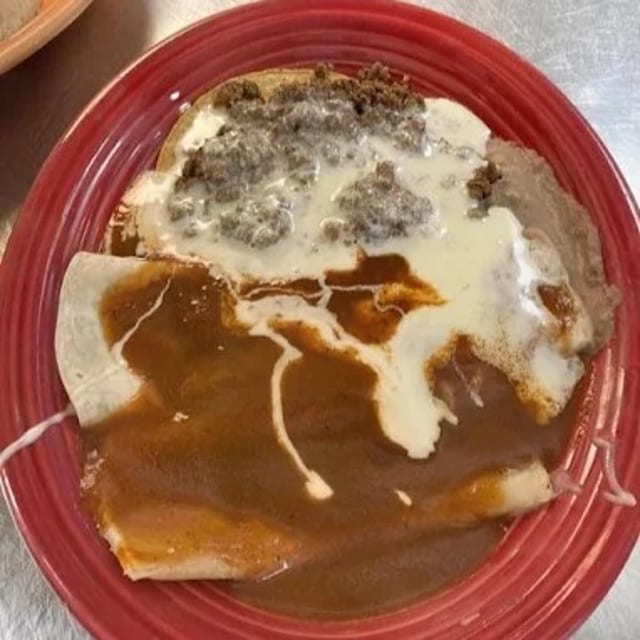 25. One Beef Burrito Topped with Cheese Dip, One Beef Enchilada & One Beef Chile Con Queso.
