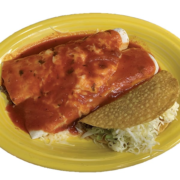 Two enchiladas covered in red sauce and a taco with shredded cheese and lettuce on a yellow plate.