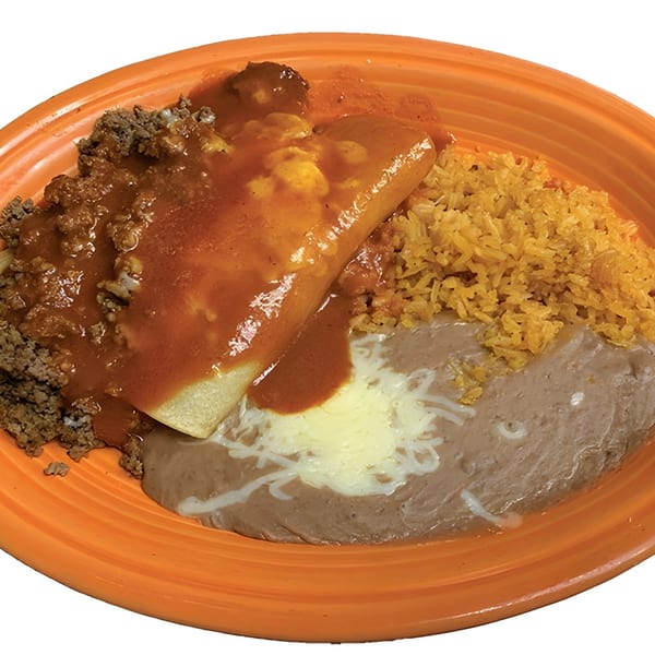 Mexican combination plate with a beef enchilada, ground beef, rice, and refried beans on an orange plate.