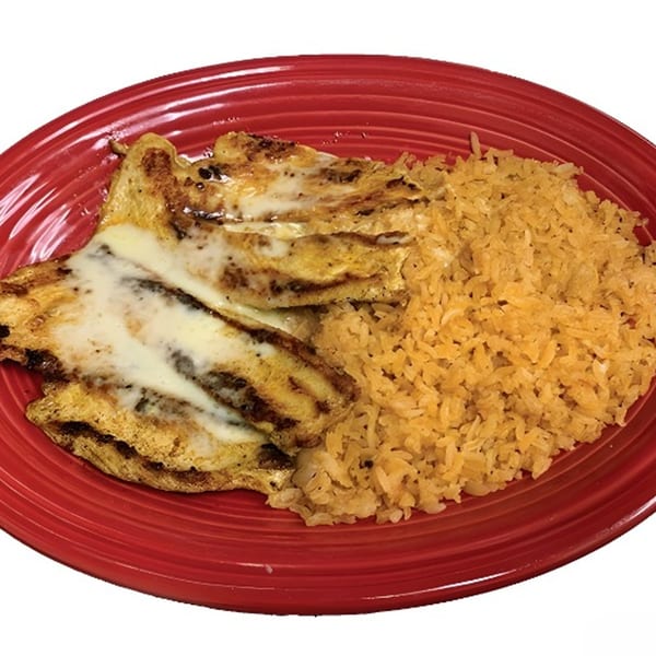 Grilled chicken breast topped with melted cheese, served with a side of yellow rice on a red plate.