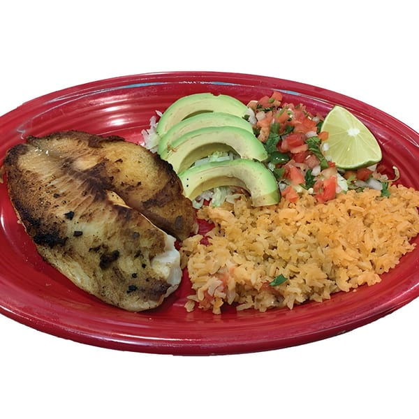 Grilled fish fillet with rice, avocado slices, pico de gallo, and a lime wedge on a red plate.
