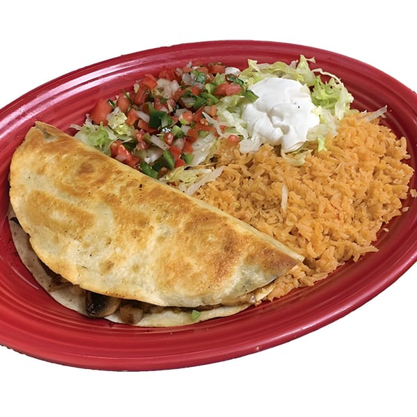 A quesadilla with rice, pico de gallo, shredded lettuce, and sour cream on a red plate.