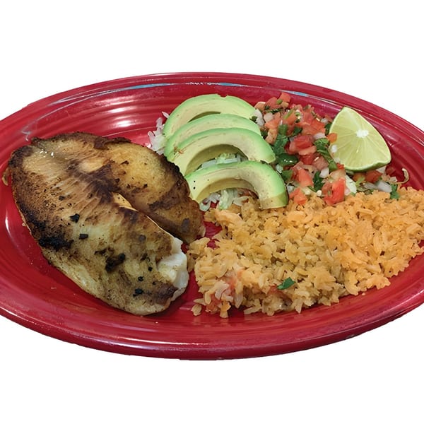 Grilled fish fillet with rice, avocado slices, pico de gallo, and a lime wedge on a red plate.